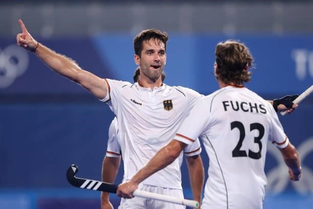 Lukas Windfeder of Team Germany celebrates with teammate Florian Fuchs after scoring their team's first goal during the Men's Semifinal match between...