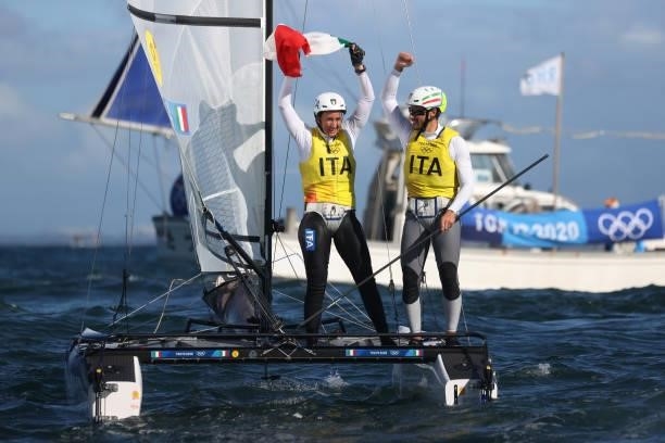 Ruggero Tita and Caterina Banti of Team Italy celebrate winning the Nacra 17 Foiling class on day eleven of the Tokyo 2020 Olympic Games at Enoshima...