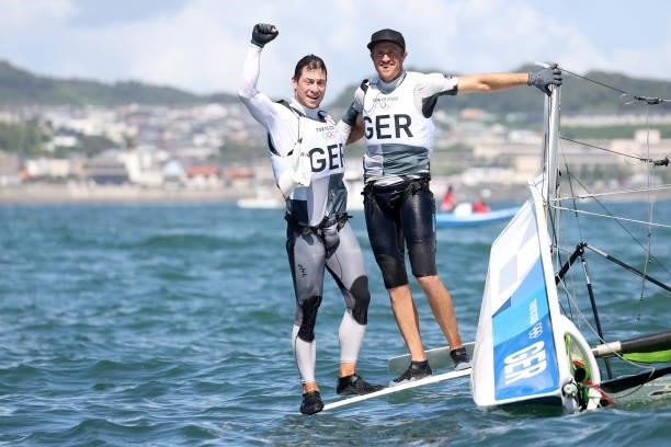 Erik Heil and Thomas Ploessel of Team Germany celebrate winning bronze for finishing third in the Men's Skiff 49er class on day eleven of the Tokyo...