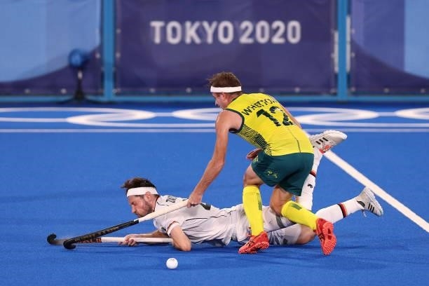 Martin Detlef Zwicker of Team Germany and Jacob Thomas Whetton of Team Australia clash during the Men's Semifinal match between Australia and Germany...
