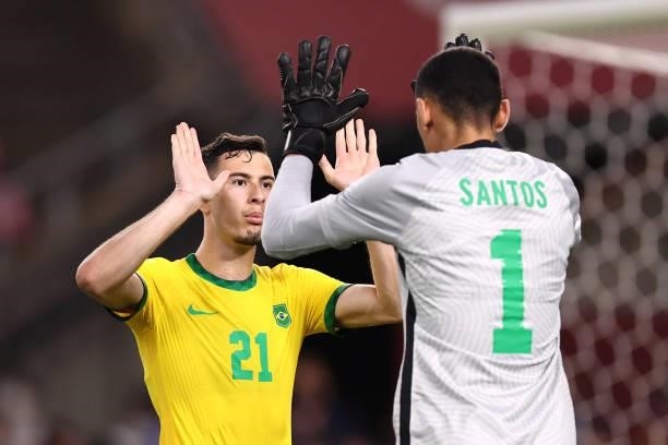Gabriel Martinelli of Team Brazil celebrates with Santos after scoring their side's second penalty during the penalty shoot out during the Men's...