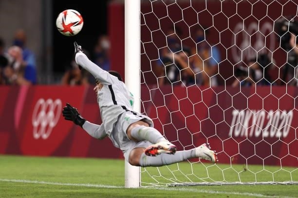 Santos of Team Brazil attempts to save the second penalty from Johan Vasquez of Team Mexico as it hits the post during the Men's Football Semi-final...