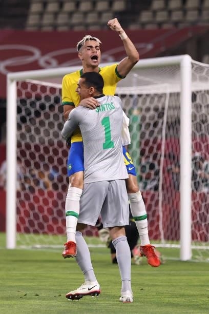 Reinier of Team Brazil celebrates with Santos after scoring their side's winning penalty during the penalty shoot out during the Men's Football...
