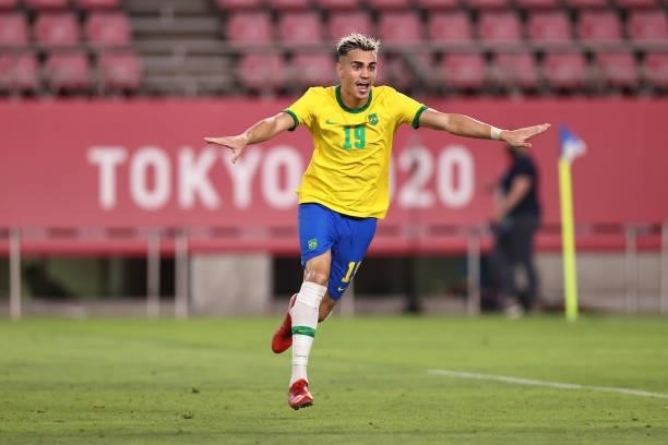 Reinier of Team Brazil celebrates after scoring their side's winning penalty during the penalty shoot out during the Men's Football Semi-final match...