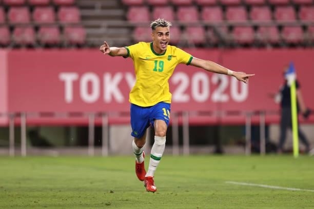 Reinier of Team Brazil celebrates after scoring their side's winning penalty during the penalty shoot out during the Men's Football Semi-final match...
