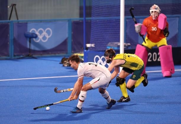 Timm Alexander Herzbruch of Team Germany attempts to shoot whilst under pressure from Edward Clive Ockenden of Team Australia during the Men's...