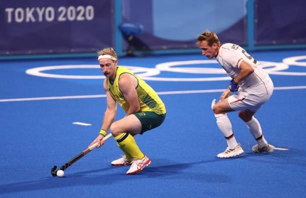 Aran Zalewski of Team Australia and Niklas Wellen of Team Germany battle for the ball during the Men's Semifinal match between Australia and Germany...