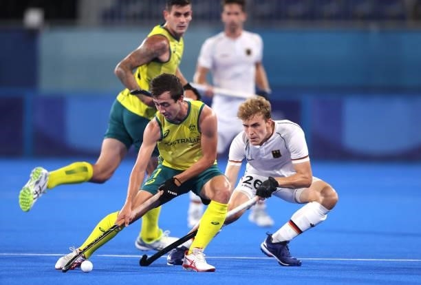 Lachlan Thomas Sharp of Team Australia and Niklas Bosserhoff of Team Germany battle for the ball during the Men's Semifinal match between Australia...