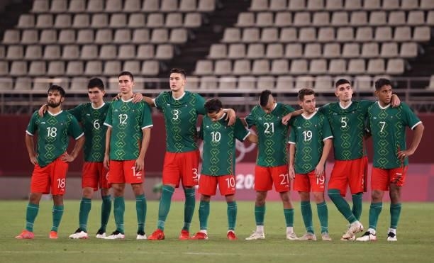 Players of Team Mexico look dejected during the penalty shoot out during the Men's Football Semi-final match between Mexico and Brazil on day eleven...