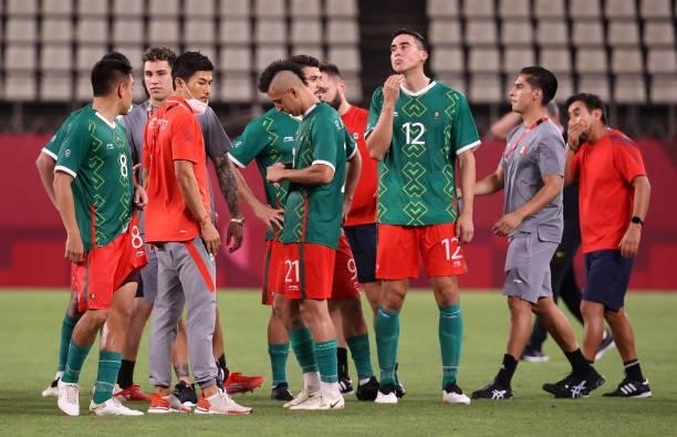 Carlos Rodriguez, Roberto Alvarado and Adrian Mora of Team Mexico look dejected following defeat in the Men's Football Semi-final match between...