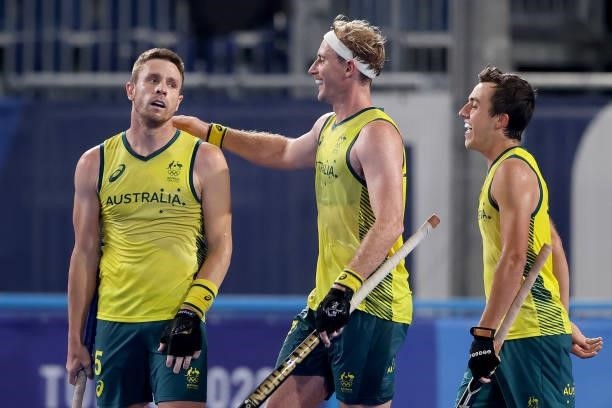 Aran Zalewski of Team Australia embraces teammate Tom Joseph Wickham following their team's third goal, scored by teammate Lachlan Thomas Sharp...