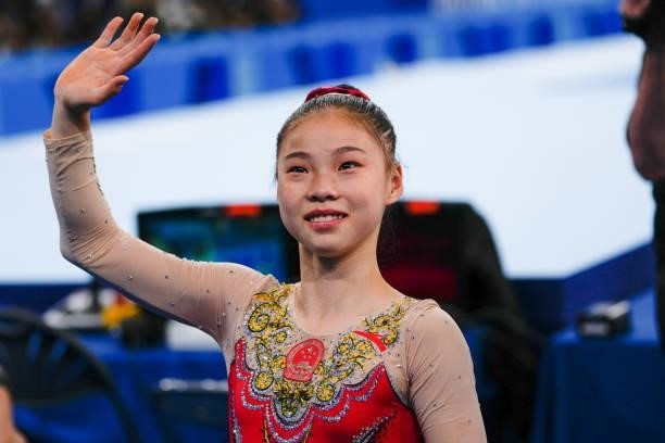 Guan Chenchen of Team China celebrates after winning the Women's Balance Beam Final on day eleven of the Tokyo 2020 Olympic Games at Ariake...