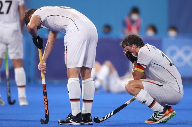 Martin Dominik Haner and Tobias Constantin Hauke of Team Germany react following a loss in the Men's Semifinal match between Australia and Germany on...