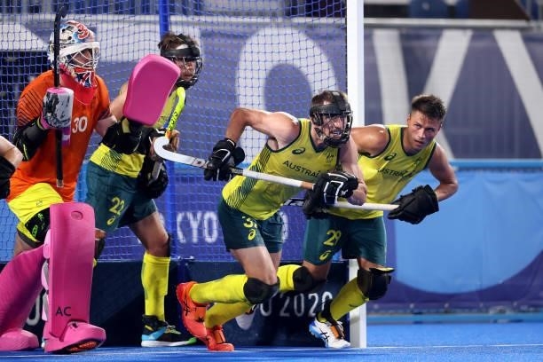 Jeremy Thomas Hayward of Team Australia runs to defend a penalty corner with defensive teammates during the Men's Semifinal match between Australia...