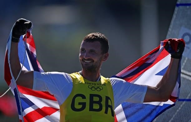 Giles Scott of Team Great Britain celebrates after winning gold in the Men's Finn class on day eleven of the Tokyo 2020 Olympic Games at Enoshima...