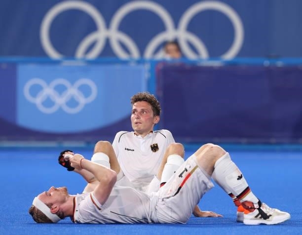Johannes Grosse and Jan Christopher Ruhr of Team Germany react following a loss in the Men's Semifinal match between Australia and Germany on day...