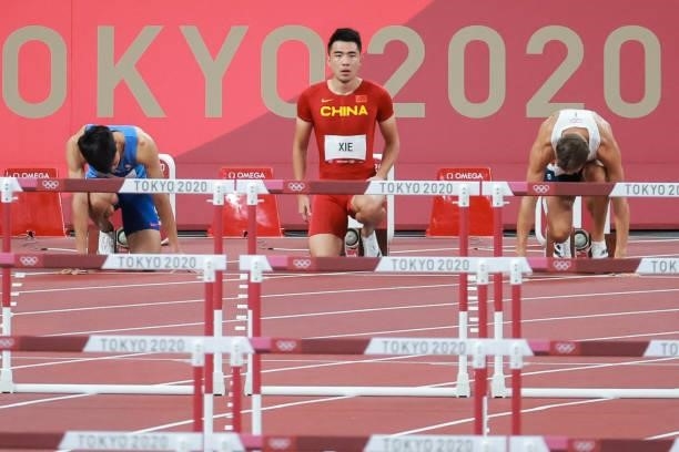Chen Kuei-Ru of Team Chinese Taipei, Wenjun Xie of Team China and David King of Team Great Britain compete in round one of the Men's 110m Hurdles...
