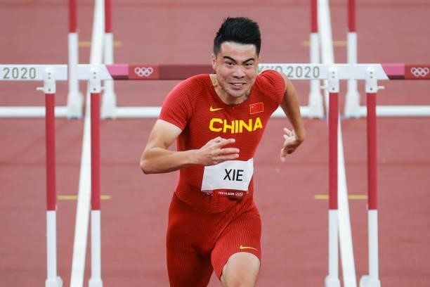 Wenjun Xie of Team China competes in round one of the Men's 110m Hurdles heats on day eleven of the Tokyo 2020 Olympic Games at Olympic Stadium on...