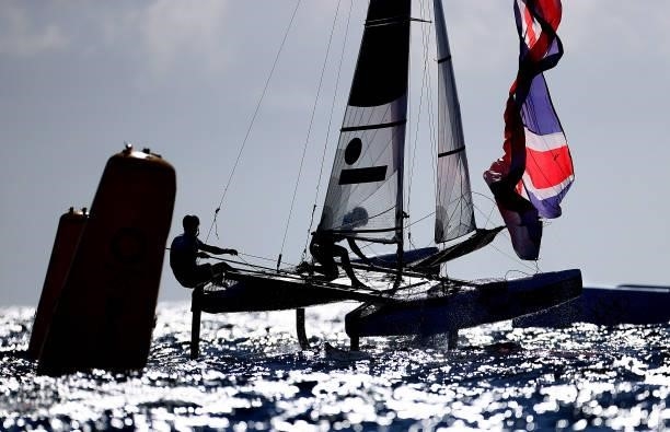 John Gimson and Anna Burnet of Team Great Britain compete in the Nacra 17 Foiling class on day eleven of the Tokyo 2020 Olympic Games at Enoshima...