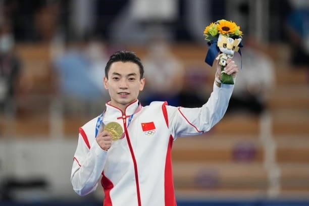 Gold medalist Zou Jingyuan of Team China poses during the medal ceremony for the Men's Parallel Bars Final on day eleven of the Tokyo 2020 Olympic...