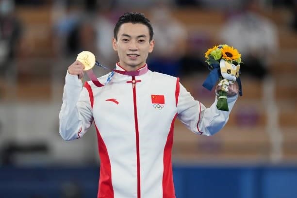Gold medalist Zou Jingyuan of Team China poses during the medal ceremony for the Men's Parallel Bars Final on day eleven of the Tokyo 2020 Olympic...