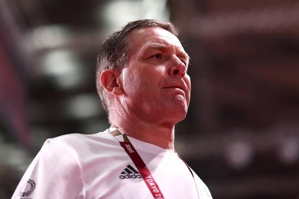 Alfred Gislason, coach of Team Germany looks dejected as he leaves the field of play after losing the Men's Quarterfinal handball match between...