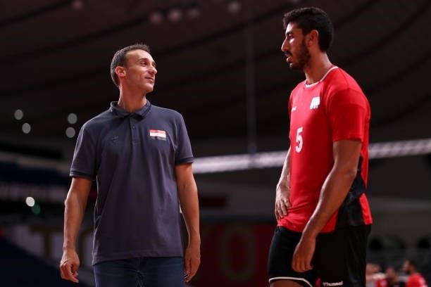 Roberto Parrondo, coach of Team Egypt and Yahia Omar of Team Egypt are seen as they leave the field of play after winning the Men's Quarterfinal...
