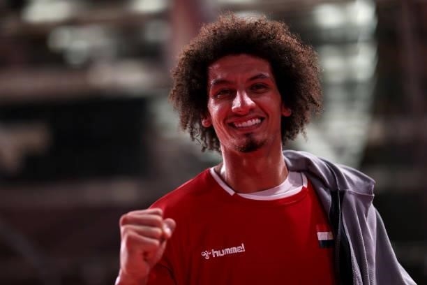 Ali Mohamed of Team Egypt celebrates while leaving the field of play after winning the Men's Quarterfinal handball match between Germany and Egypt on...