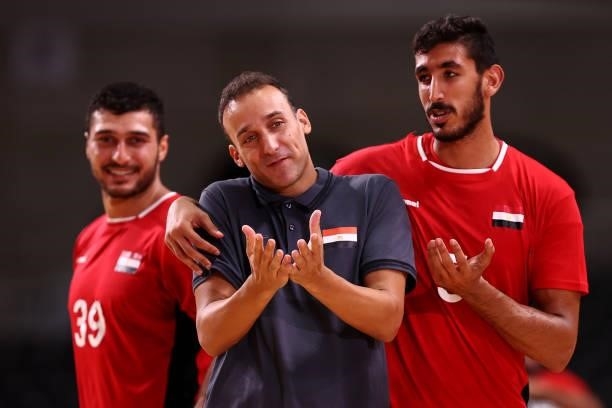 Yehia Elderaa, Roberto Parrondo, coach of Team Egypt and Yahia Omar of Team Egypt are seen as they leave the field of play after winning the Men's...