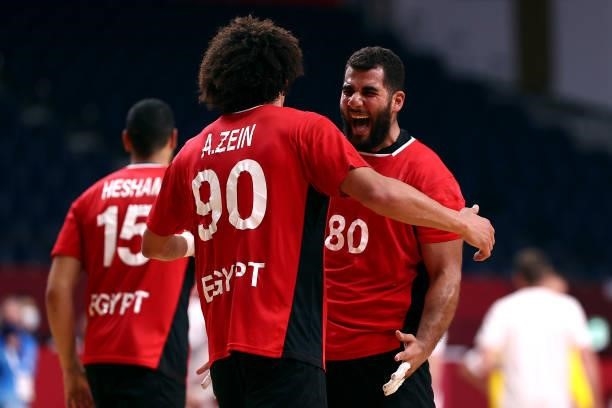 Ahmed Mesilhy and Ali Mohamed of Team Egypt celebrate after winning the Men's Quarterfinal handball match between Germany and Egypt on day eleven of...