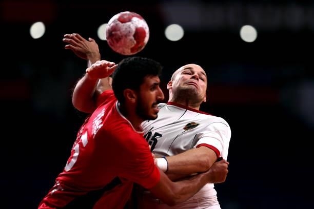 Paul Drux of Team Germany and Yahia Omar of Team Egypt compete for the ball during the Men's Quarterfinal handball match between Germany and Egypt on...