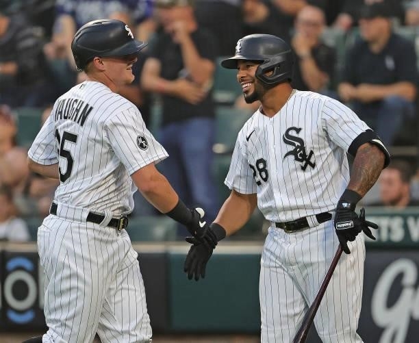 Andrew Vaughn of the Chicago White Sox is congratulated by Leury Garcia after hitting a solo home run in the 2nd inning against the Kansas City...