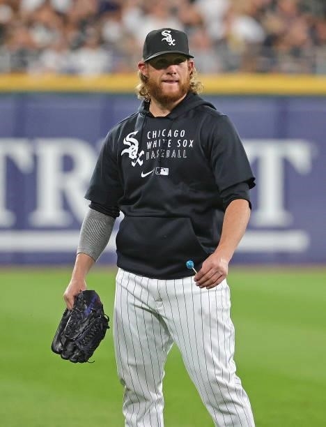 Craig Kimbrel of the Chicago White Sox talks to an umpire as he walks out to the bullpen during a game against the Kansas City Royals at Guaranteed...