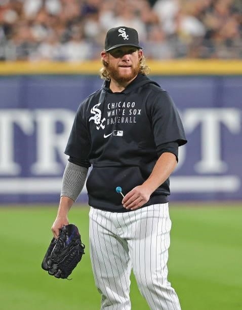 Craig Kimbrel of the Chicago White Sox talks to an umpire as he walks out to the bullpen during a game against the Kansas City Royals at Guaranteed...