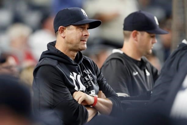 Manager Aaron Boone of the New York Yankees looks on against the Baltimore Orioles at Yankee Stadium on August 03, 2021 in New York City. The Yankees...