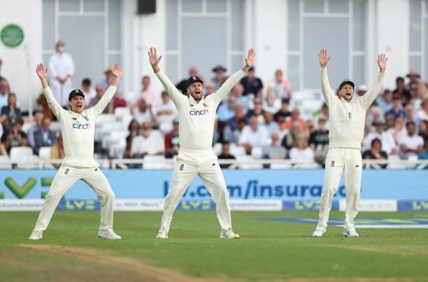 Rory Burns, Dom Sibley and captain Joe Root of England appeal for an lbw during day one of the First LV= Insurance test match between England and...