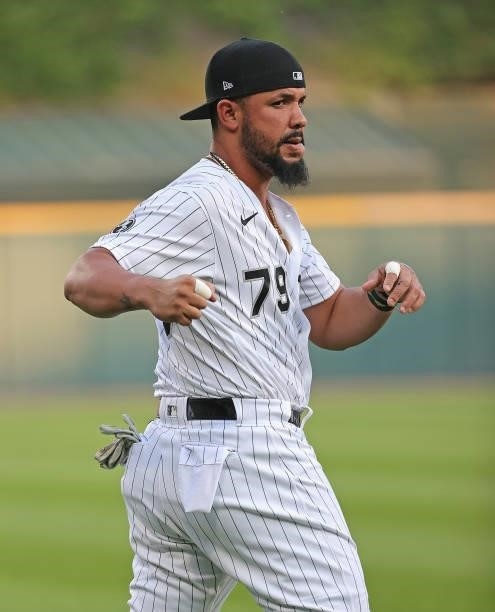 Jose Abreu of the Chicago White Sox stretches before a game against the Kansas City Royals at Guaranteed Rate Field on August 03, 2021 in Chicago,...
