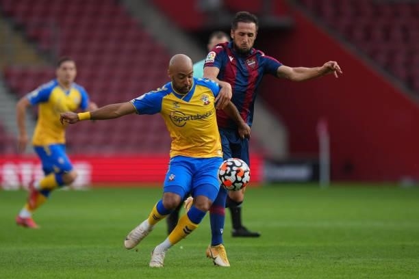 Nathan Redmond of Southamptoni schallenged by Jorge Miramon of Levante during a pre season friendly between Southampton and Levante at St Mary's...