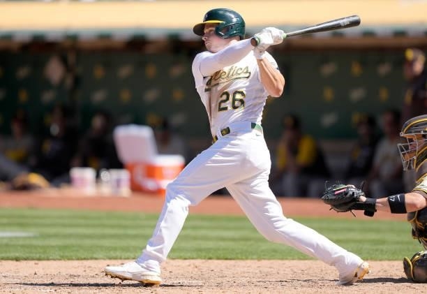 Matt Chapman of the Oakland Athletics hits an RBI single that scored Ramon Laureano against the San Diego Padres in the bottom of the ninth inning at...