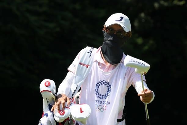 Tomoaki Okushima, caddie to Mone Inami of Team Japan, looks on from the 17th green during the second round of the Women's Individual Stroke Play on...