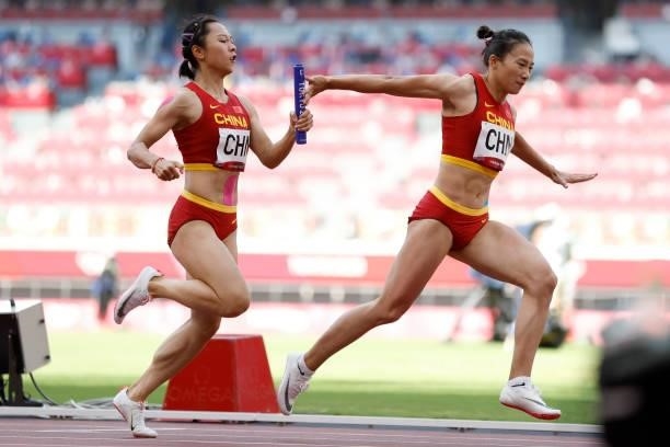 Ge Manqi and Huang Guifen of Team China compete in the Women's 4 x 100m Relay Round 1 Heat 2 on day thirteen of the Tokyo 2020 Olympic Games at...