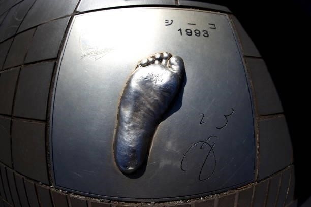 Statue of the foot of former footballer, Zico is seen on a wall outside the stadium prior to the Women's Bronze Medal match between United States and...
