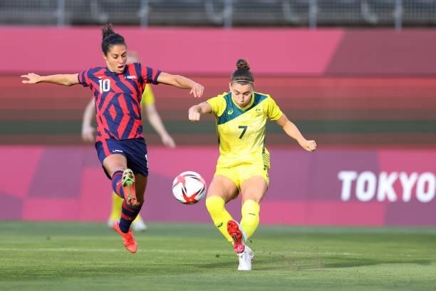 Steph Catley of Team Australia makes a pass whilst under pressure from Carli Lloyd of Team United States during the Women's Bronze Medal match...