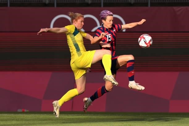 Megan Rapinoe of Team United States runs with the ball whilst under pressure from Clare Polkinghorne of Team Australia during the Women's Bronze...