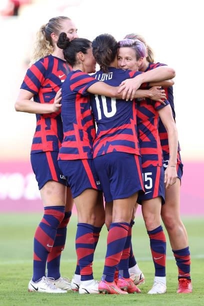 Megan Rapinoe of Team United States celebrates with Carli Lloyd and team mates after scoring their side's second goal during the Women's Bronze Medal...