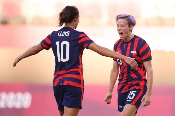 Megan Rapinoe of Team United States celebrates with teammate Carli Lloyd after scoring their side's second goal during the Women's Bronze Medal match...