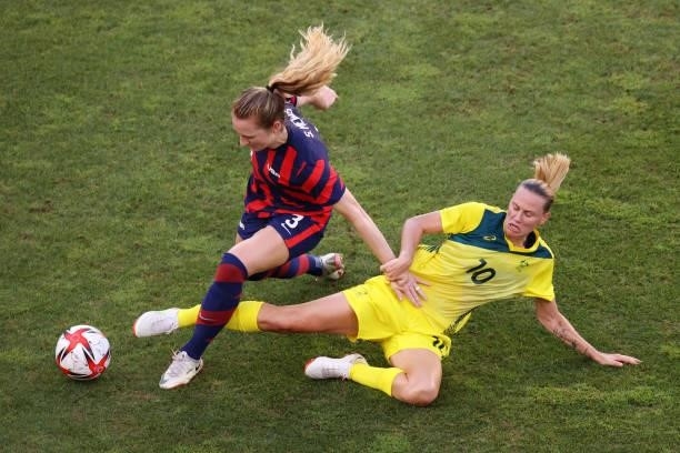 Samantha Mewis of Team United States is challenged by Emily Van Egmond of Team Australia during the Women's Bronze Medal match between United States...
