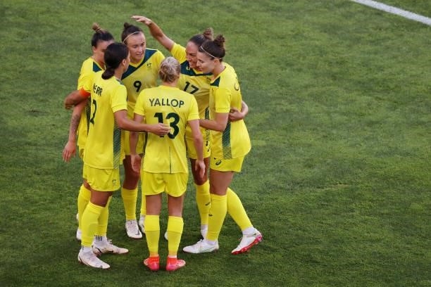 Sam Kerr of Team Australia celebrates with team mates after scoring their side's first goal during the Women's Bronze Medal match between United...