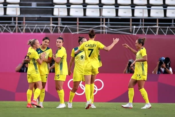 Sam Kerr of Team Australia celebrates with teammates after scoring their side's first goal during the Women's Bronze Medal match between United...