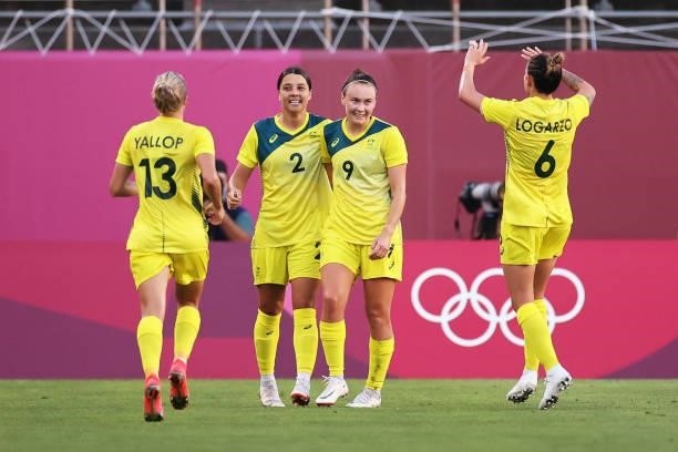Sam Kerr of Team Australia celebrates with Caitlin Foord and teammates after scoring their side's first goal during the Women's Bronze Medal match...